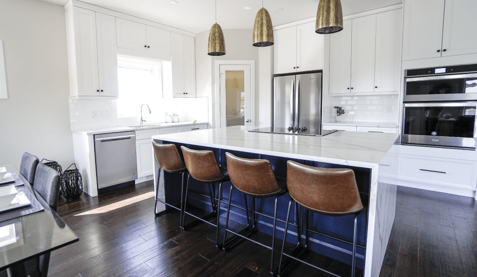 a kitchen with a bar and stools